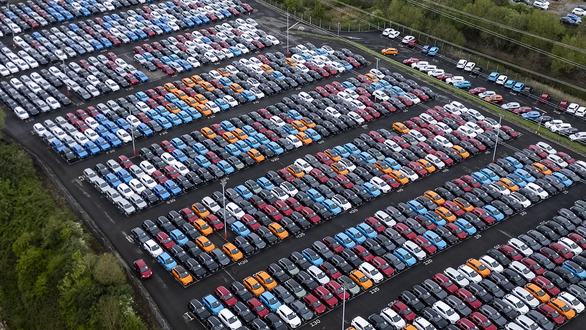 China floods Britain with electric cars: Stunning images show thousands that arrived in UK on just one ship amid fears that Beijing could use them to spy on Brits [Video]