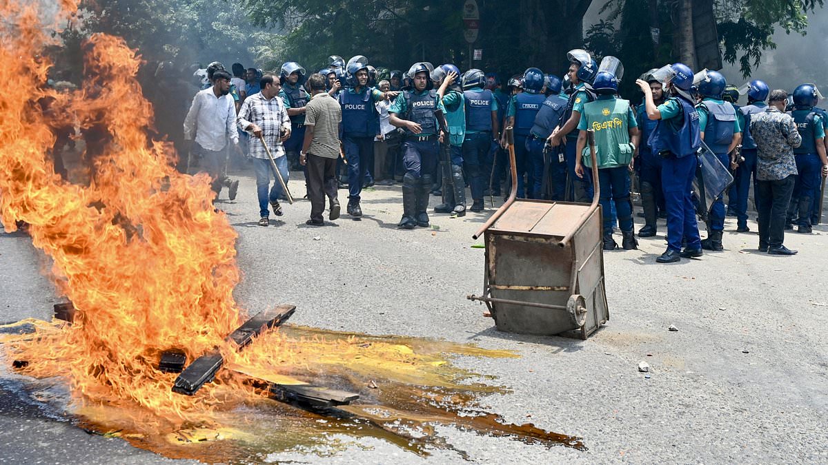 Chaos in Bangladesh as student protesters set state TV headquarters on fire with ‘many people’ trapped inside as deadly anti-government riots spiral out of control [Video]